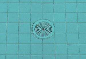 Pictured: A pool drain on the floor of a filled pool